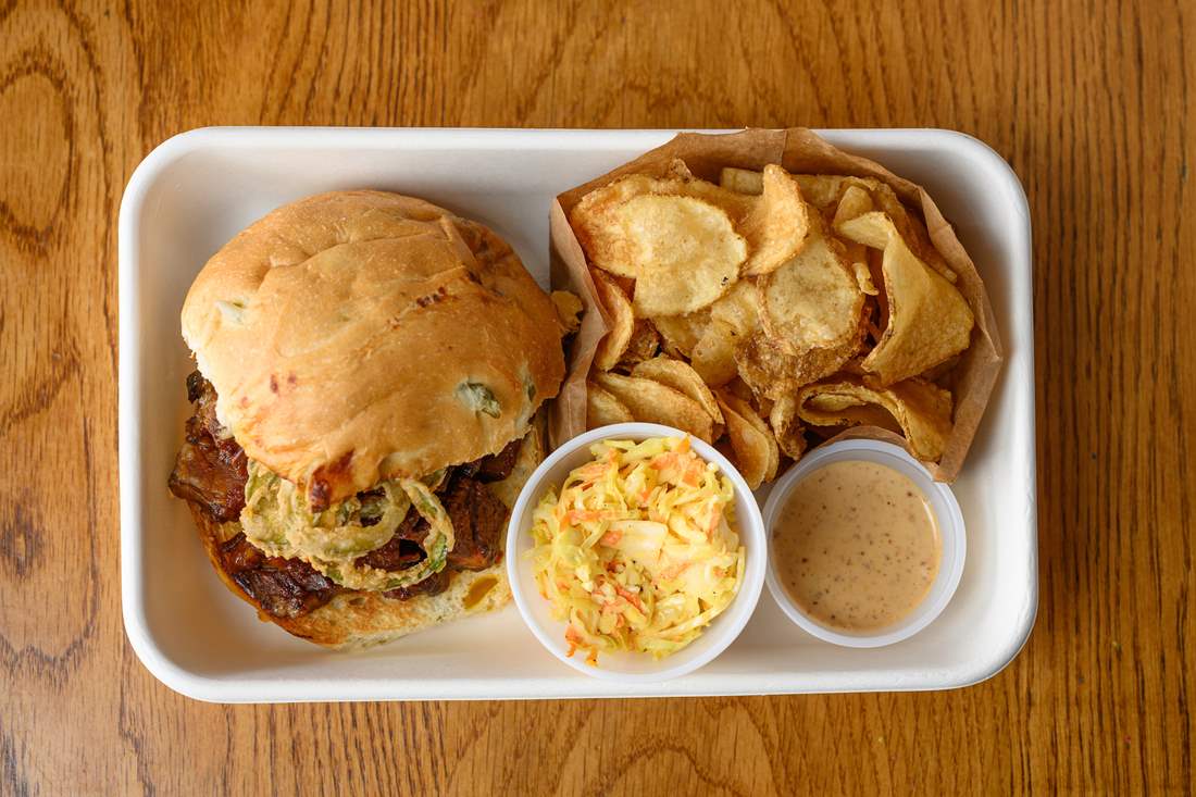 Photo of brisket sandwich to-go